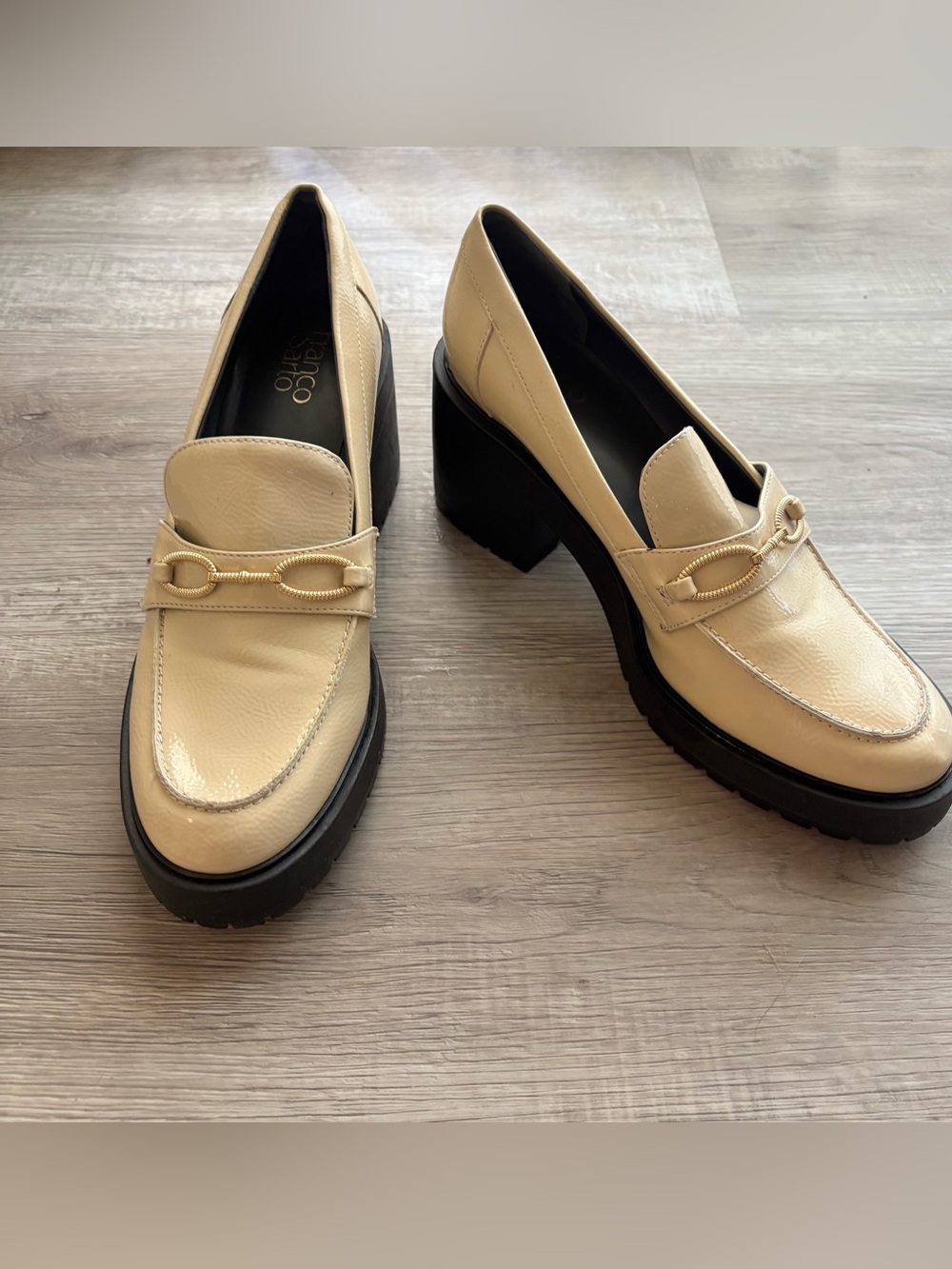 Franco Sarto cream-colored heeled loafers with a gold-tone bit buckle detail 11